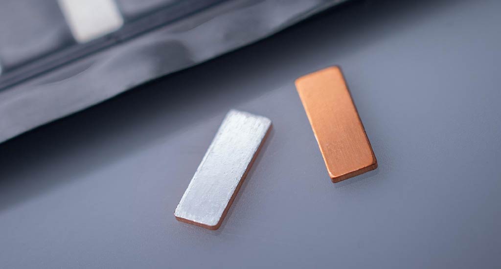 Bond pads and packaging tape used in manufacturing for secure component handling. 